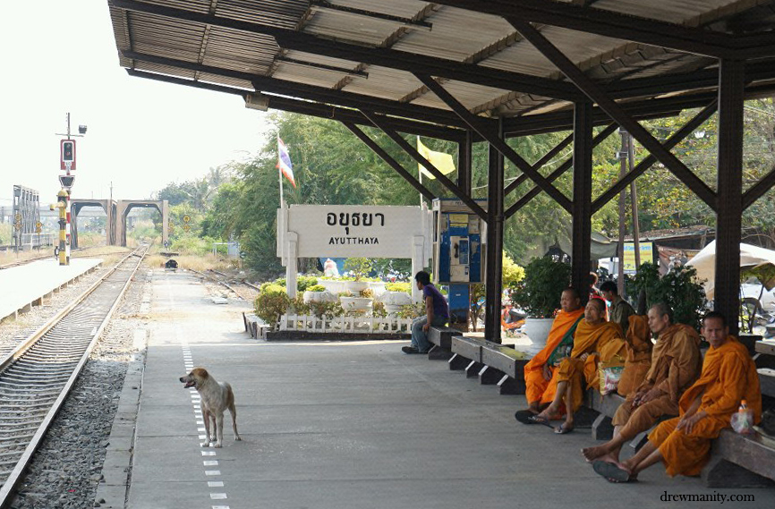 monks wait for train